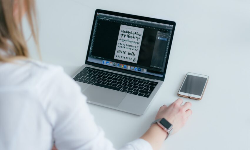 woman choosing fonts for design